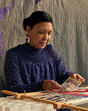 A photo of Sante Johnson wearing a dark blue dress.
